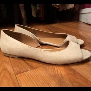 Tan peep-toe flats